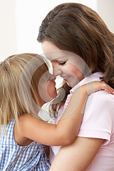 Close Up Of Affectionate Mother And Daughter At Ho photo