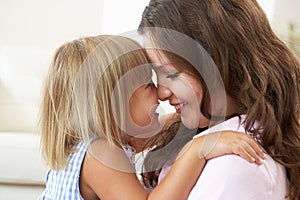 Close Up Of Affectionate Mother And Daughter At Ho photo