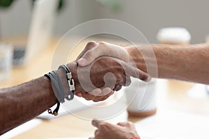 Close up African American businessman shaking hand of business partner