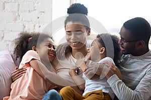 Close up african american happy family with two children enjoy.