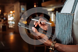 Close up african american male holding digital tablet