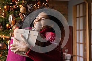 Close up African American woman thanking man for Christmas gift