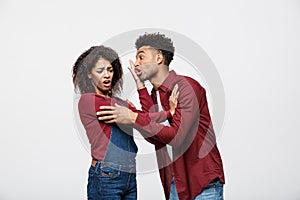 Close-up of African American young couple deny kissing over white background studio