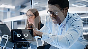 Close Up of an African Engineer Using a Screwdriver While Developing a Robot Dog Concept. Black