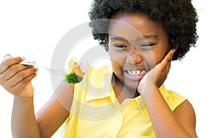 Close up of african girl refusing vegetables.