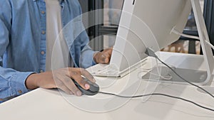 Close up of African Male Hand Using Computer Mouse for Work