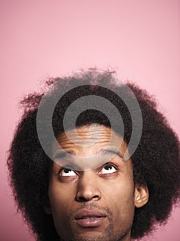 Close up African man looking up in studio shot