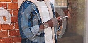 Close up african man with smartphone on city street