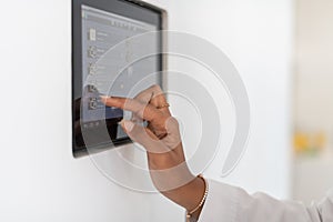 Close up african woman using smart home screen