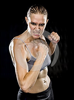 Close up Aggressive Athletic Woman in Combat Pose