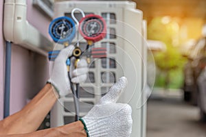 Close up of Air Conditioning Repair, repairman on the floor fixing air conditioning system