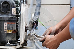 Close up of Air Conditioning Repair, repairman on the floor fixing air conditioning system