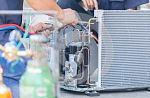 Close up of Air Conditioning Repair team use fuel gases and oxygen to weld or cut metals, Oxy-fuel welding and oxy-fuel cutting