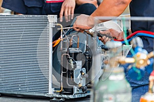 Close up of Air Conditioning Repair team use fuel gases and oxygen to weld or cut metals, Oxy-fuel welding and oxy-fuel cutting