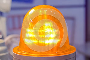 Close up of alarm lamp signal warning flashing light for industrial machinery