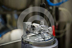 Close-up of alcohol distillery tap