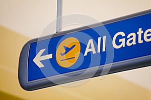 Close-up of all gates direction sign in airport