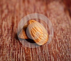 Close Up of almond nuts on wooden background