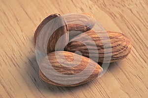 Close up almonds on wooden