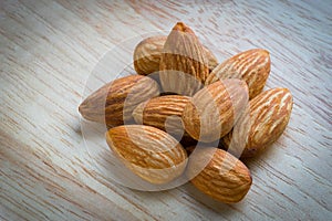 Close up almonds on wooden