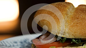 Close up of amazing big tasty fresh meat sandwich with fresh vegetables and herbs, foodporn concept. Stock footage