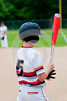 Close-up of american baseball boy from behind.