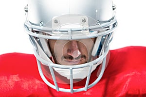 Close-up of American football player in red jersey looking down