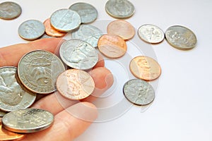 American quarter, dime coins in hand on dollar usa background