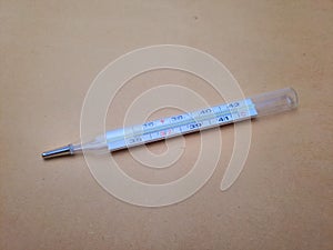 close up of analog clinical thermometer for medical purpose