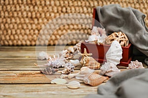 Close up Ancient casket for jewelry with collection of different seashells on wooden table