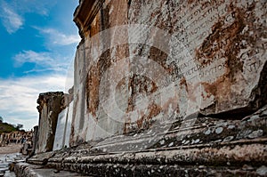 Close up ancient Greek inscription on stone block, Ephesus, Turkey