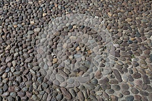 Close up of Ancient Stone Ground: Cobblestone Road in City Street in Italy