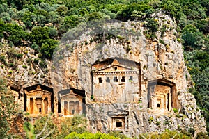 Lycian tombs of the kings carved into the cliffs of river Dalyan in Turkey. photo