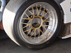 Close Up Angle View of Race Car Wheel and Tire photo
