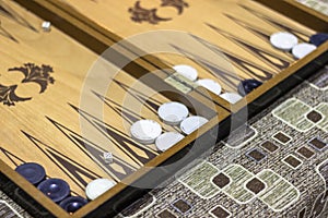 Close-up angled shoot of dice of backgammon under dim light