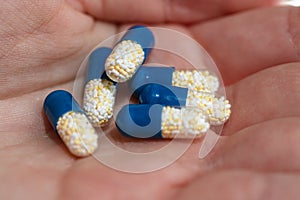 Close up of antibiotics capsules or painkillers isolated on white. Medicine concept, pills close up, copy space