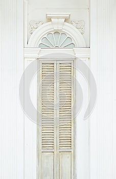 Close up antique chinese traditional white Chino-Portuguese door background. Asia architecture vintage style on Old Phuket Town Ro