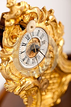 Close-up of antique gold clock