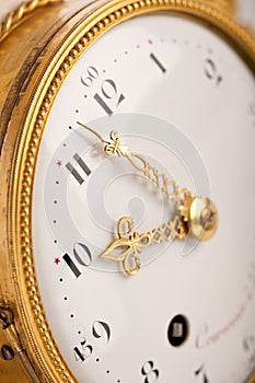 Close-up of antique gold clock