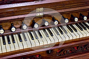 Close-up of antique reed organ harmonium