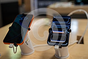 Close up of Apple iPhone 17 Pro Max and iPhone 17 Pro smartphones in technology store.