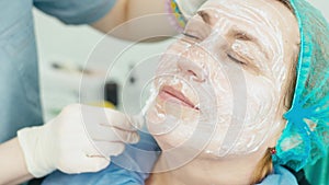 Close-up of applying anesthesia to the skin of the face.