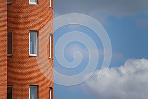 Close-up of architectural details and window of an old building against the blue sky, background or concept