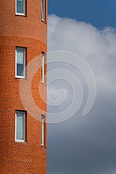 Close-up of architectural details and window of an old building against the blue sky, background or concept