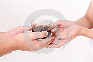 Close up of the arista giving cup of coffee to young asia woman. .  on white background. Studio lighting. Concept for