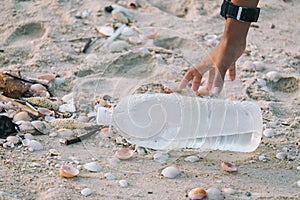 Close-up of arms Children are picking up plastic bottles