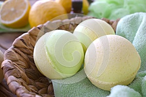 Close up aromatherapy spa concept with bath bombs and fresh lemons.