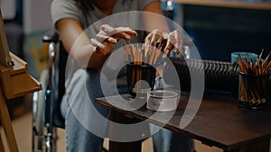 Close up of art tools and pencils on table in artwork space
