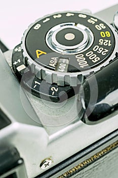A close up of a asa iso dial on a 35mm camera