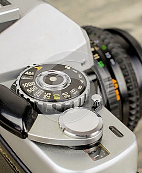 A close up of a asa iso dial on a 35mm camera